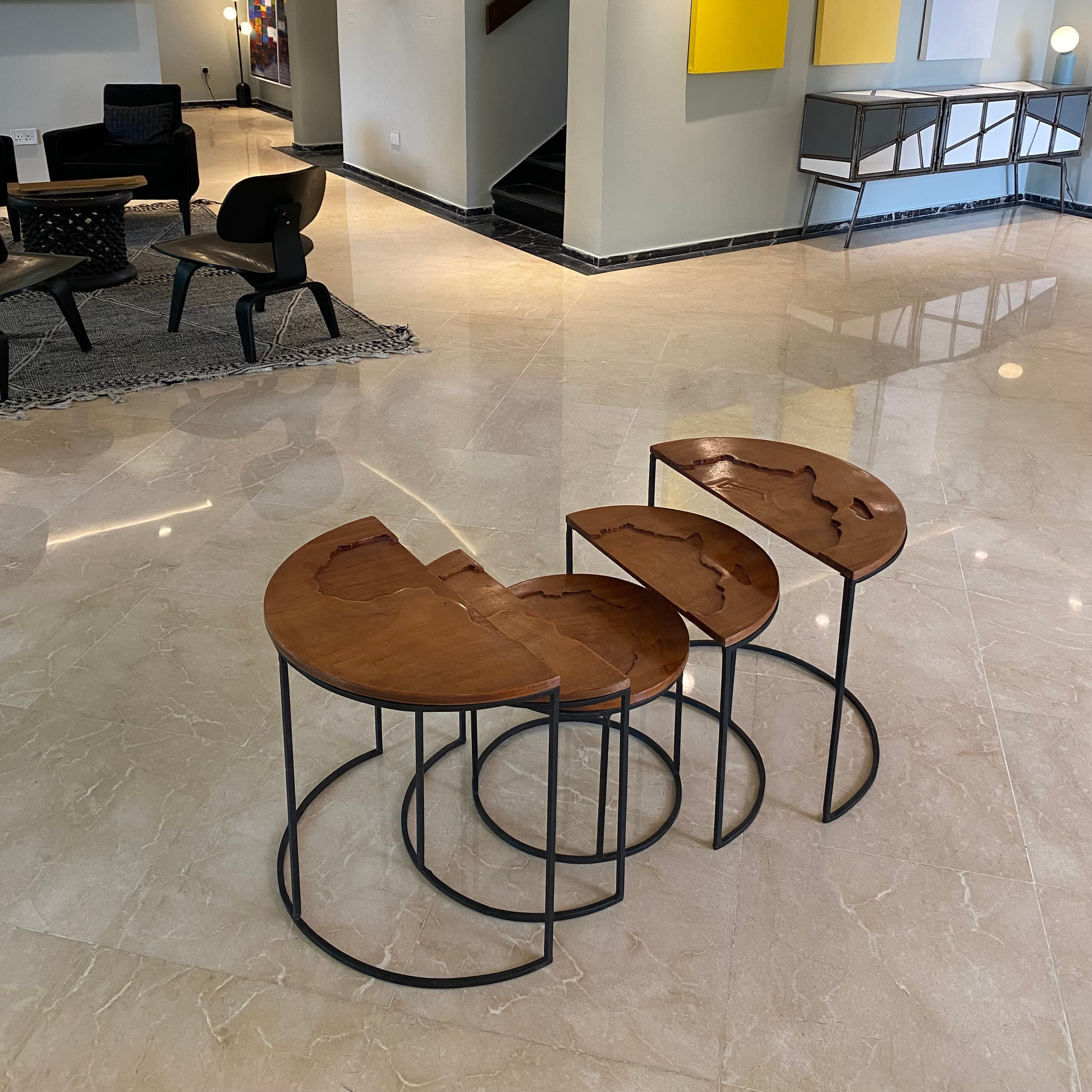 A collection of sculptural wooden tables in Keniye Koroye's showroom
